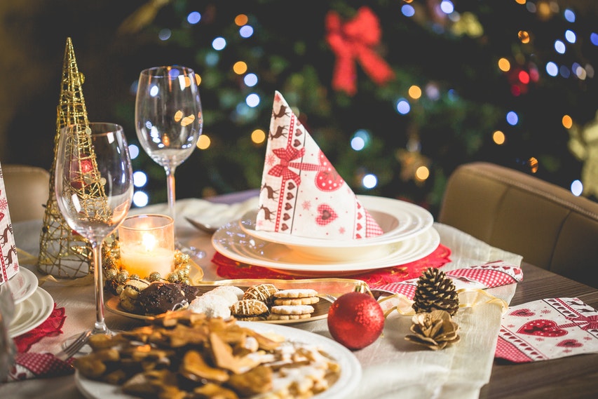 Decorated Christmas Table With Food & Wine Glass